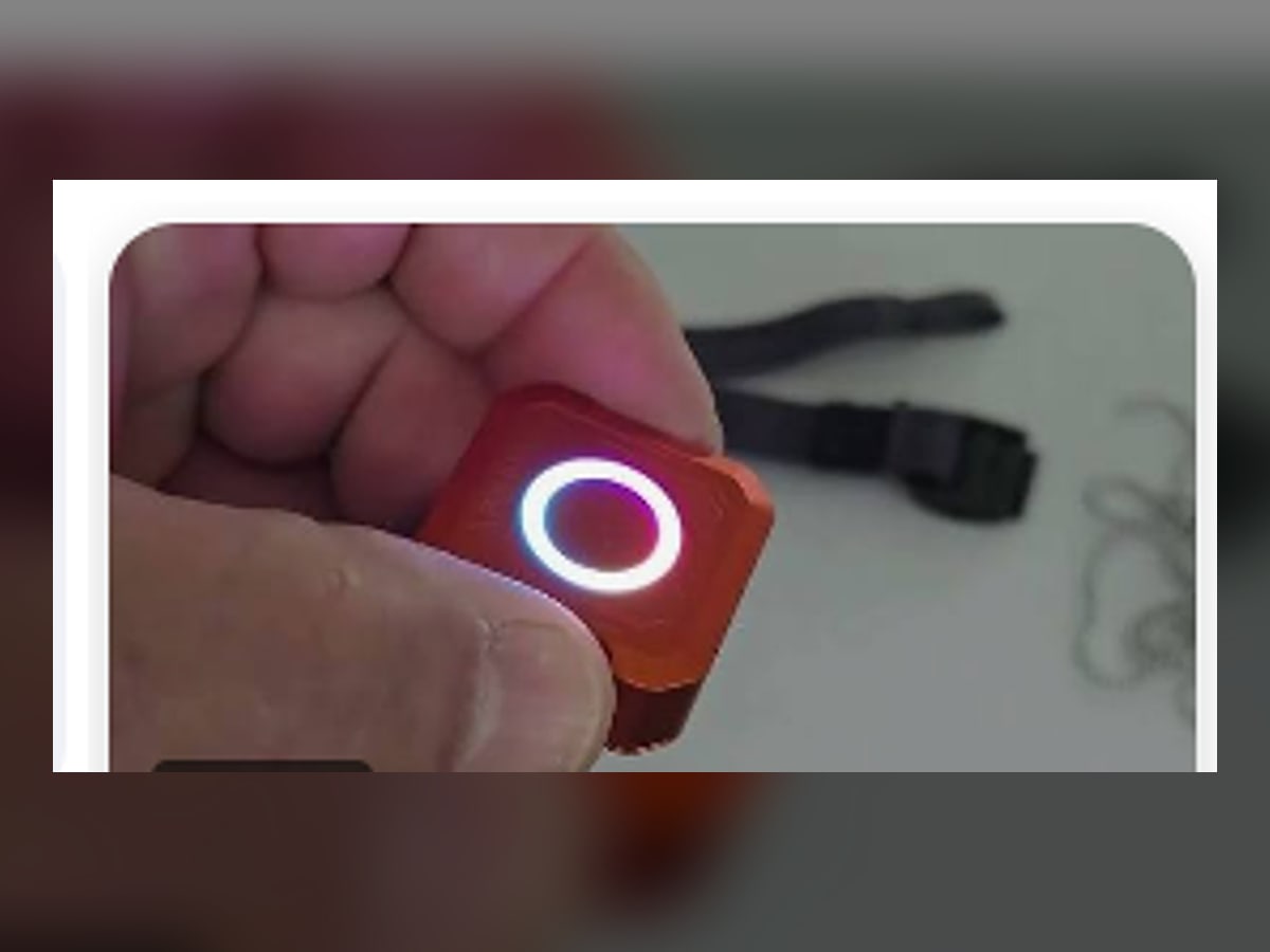 Compact SOFIRN SE1 wearable EDC light clipped to a black cap